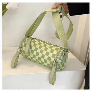 Detail of checkered cylinder crossbody bag with wide strap and silver hardware accents