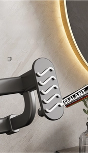 Applying heavy-duty sealant to the matte grey space aluminum towel rack base for easy no-drill installation