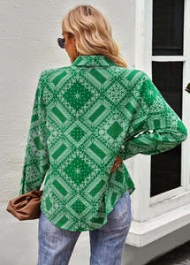 Back view of women's long sleeve paisley print blouse with a curved hem and shirt collar
