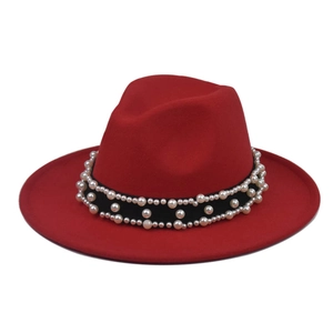 Detail of red wool fedora hat featuring double-row pearl beads and black ribbon band