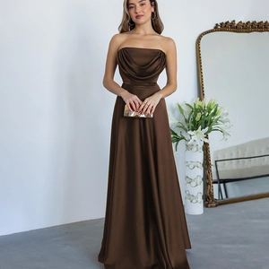 Detail view of a chocolate brown satin strapless dress with an elegant draped neckline