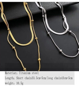 Detailed view of layered titanium steel snake chains in gold and silver finishes