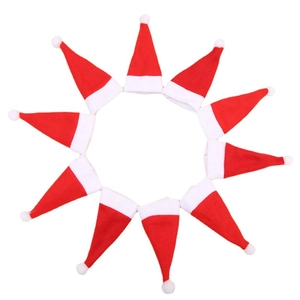 Set of 10 mini red Christmas hats for cutlery and bottle decorations on white background