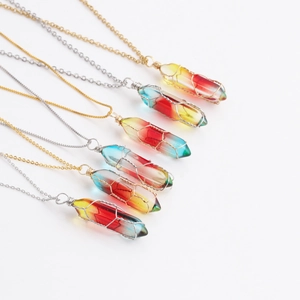 Detail of six wire-wrapped hexagonal crystal pendants with colorful gradient on metal chains