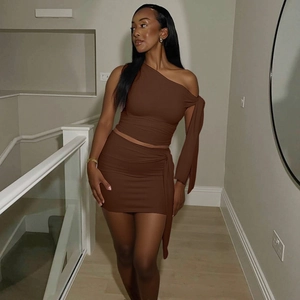 Detail of dark brown off-shoulder long sleeve top and slim-fit mini skirt set