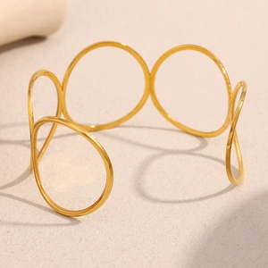 Minimalist 18K gold plated stainless steel open bangle featuring layered geometric circles