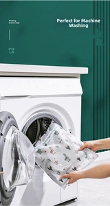Putting cartoon polyester mesh laundry bag with pink alpaca pattern into washing machine