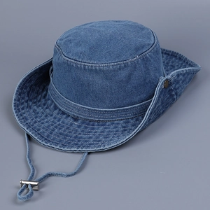 Detail of blue denim hiking hat with reinforced stitching and adjustable windproof rope