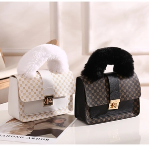 Detail of mini handbags featuring plush handles, geometric prints and gold twist locks