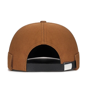 Brown docker brimless hat with black leather strap and silver metal buckle, back view
