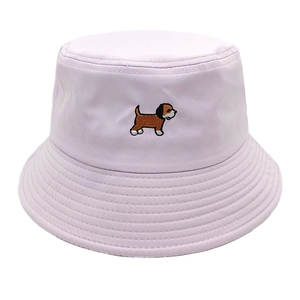 Detail shot of cute dog embroidery on a lavender cotton bucket hat for women