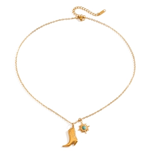 Golden stainless steel cowboy boot necklace with turquoise sun charm on white background