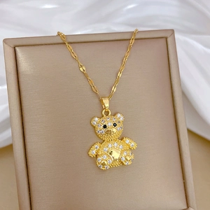 Sparkling teddy bear pendant necklace with crystals on gold chain in a premium gift box