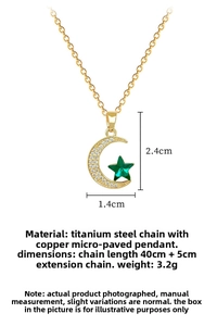 Macro detail of gold star and crescent moon pendant with crystals and dimensions