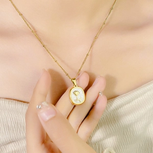 Exquisite gold rose enamel necklace with mother of pearl pendant on a fine bead chain