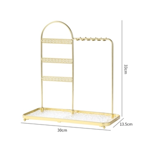 Golden metal jewelry stand for earrings and necklaces with a textured base, 30x13.5x33cm