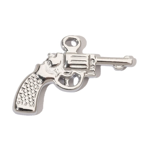 Detailed close-up of a silver stainless steel revolver pistol pendant with textured grip