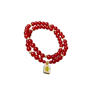 Double-layer red agate bead bracelet with golden spacers and a mahjong Fa pendant