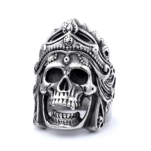 Macro detail of gothic skull ring with crown featuring antique silver metal texture
