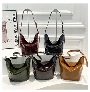 Detailed collection of vintage glossy hobo shoulder bags in five classic colors