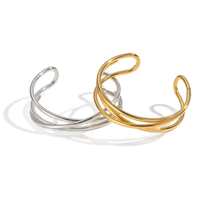 Minimalist geometric wrap bracelets in polished gold and silver layered open design