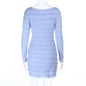 Detailed back view of light blue dress showing horizontal ruffled texture on a white mannequin
