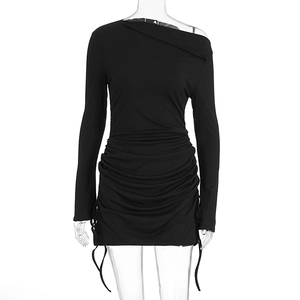 Detail of black rib-knit mini dress with side drawstring ruching and asymmetric neckline