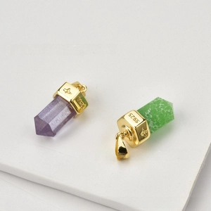 Detail showing S925 silver engraving on gold-plated hexagonal crystal pendants