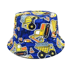 Detail of blue cotton bucket hat with yellow cartoon construction vehicle prints
