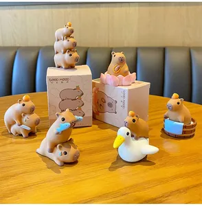 Close-up of matte resin capybara figurines with creative bath and lotus poses