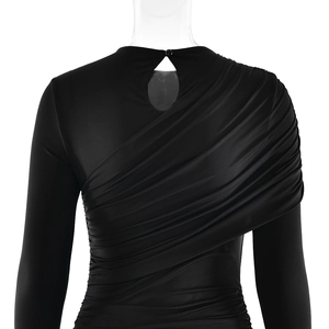 Detailed view of back pleats and cutout button closure on long sleeve black dress