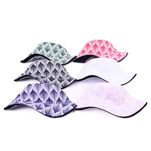 Flat lay of wide brim bucket hats in six colors with geometric leaf patterns and wavy edges