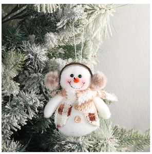 Detailed plush snowman Christmas tree ornament with a checkered scarf and wooden buttons