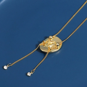 Minimalist gold cowboy hat style adjustable necklace with quilted sliding pendant