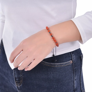 Morse code strength bracelet with red agate beads on adjustable black woven cord strap