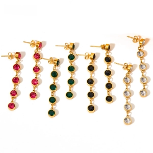 Detail of long tassel earrings with colorful zircons in rose red, green, and black