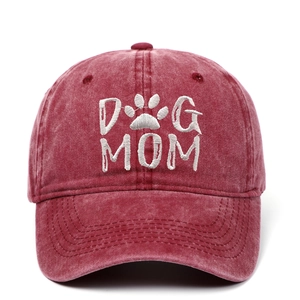 Close-up of Dog Mom embroidered washed cotton baseball cap in vintage maroon finish