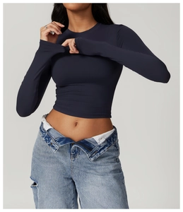 Close-up of tight-fitting navy blue long sleeve yoga top with high elasticity and crew neck