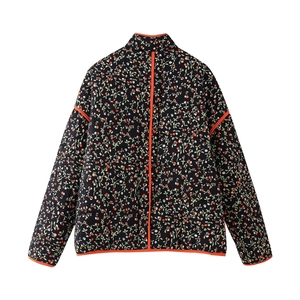 Back view of a black quilted jacket with floral print and contrasting orange borders