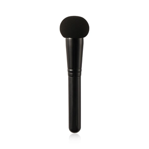Detail shot of professional black sponge concealer brush with durable plastic handle