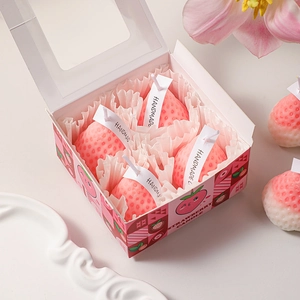 Pink gradient strawberry shaped candle gift set with 4 handmade candles in a cartoon box