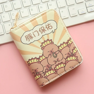 Detail of compact Capybara cartoon wallet with zipper on a desk with keyboard