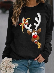 Detailed close-up of a Christmas reindeer print on a black long-sleeve sweatshirt