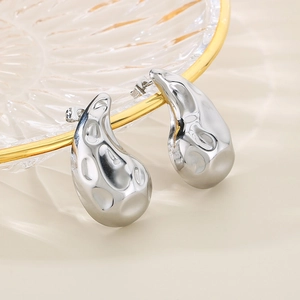 Modern silver crescent teardrop stud earrings with textured fluid metal design