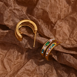 Detail of 18K gold-plated double C-shape earrings with colorful cubic zirconia stones