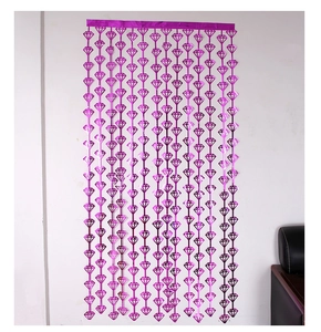 Detail view of purple diamond-cut foil curtain hanging for party backdrop decoration