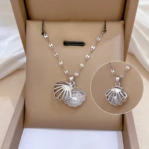 Shell pendant necklace with hidden pearl and micro-pasted zircons in jewelry box
