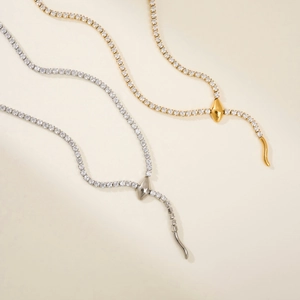 Elegant 18k gold and silver snake shaped tennis necklaces with shimmering white zircon