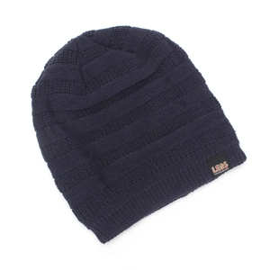 Close-up of thick knit beanie with ribbed texture and LEDS brand label detail