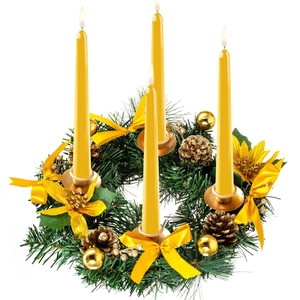 Christmas Advent wreath with four yellow candles, gold ribbons, pine cones and ornaments